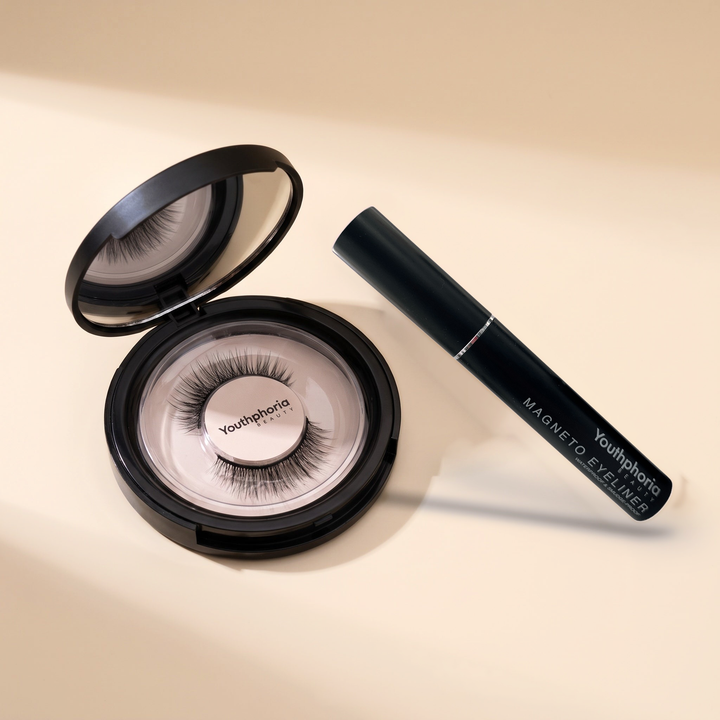 Youthphoria Magnetic Lashes and Liner Kit: an open mirror compact with a pair of magnetic eyelashes and the Magneto magnetic eyeliner
